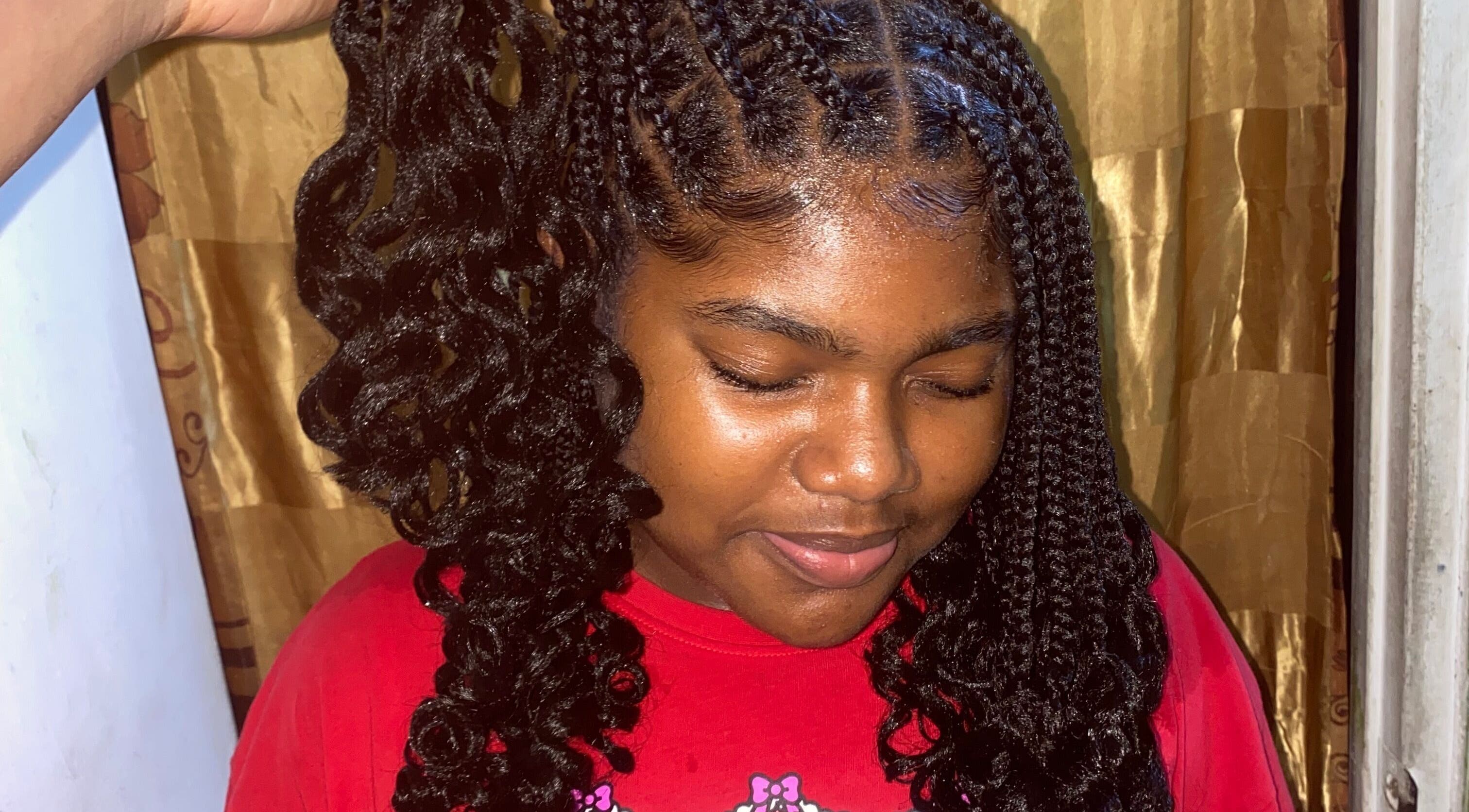 Stylish braided hairstyle at Hairbyreen, Prospect, St. George, VC, highlighting intricate detail.