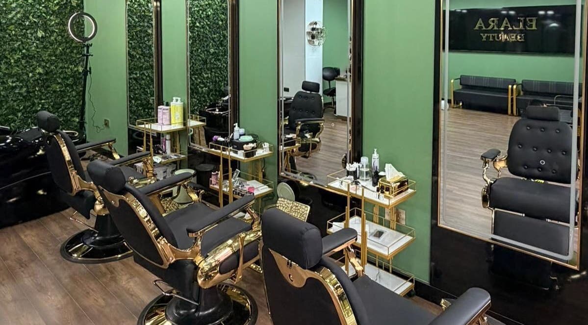 Luxurious salon chairs at ELARA BEAUTY, Tranent, Scotland, GB. Elegant decor with mirrors and green walls.
