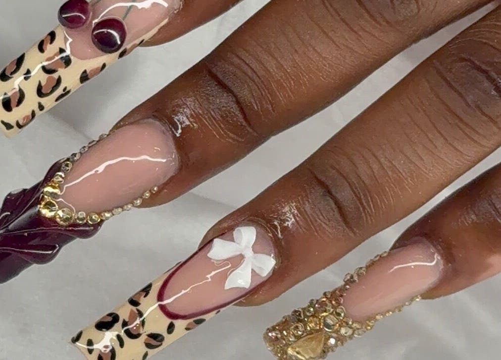 Intricate nail art at Prettynpolished, Bell Post Hill, Victoria, AU with leopard print and embellishments.