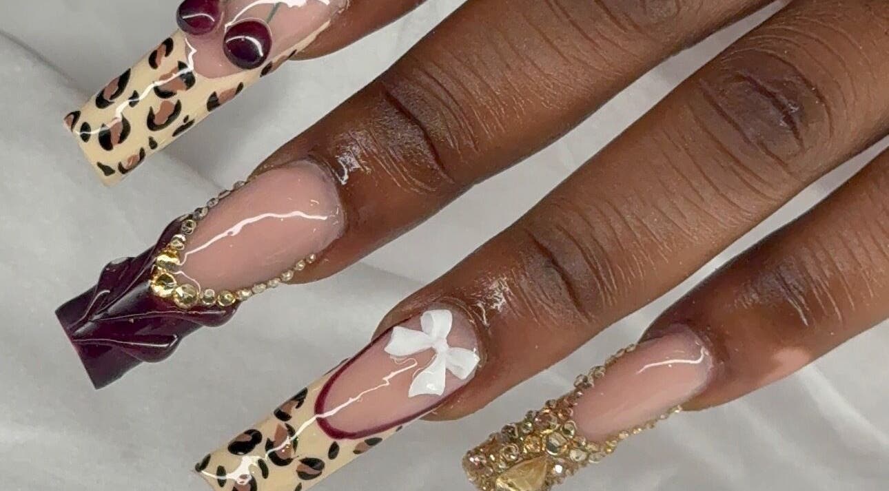 Intricate nail art at Prettynpolished, Bell Post Hill, Victoria, AU with leopard print and embellishments.