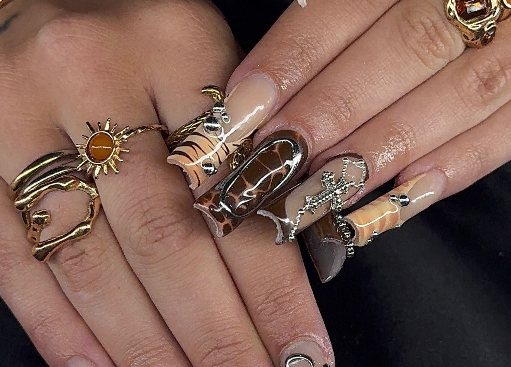 Intricate nail art and gold rings at Prettynpolished, Bell Post Hill, Victoria, AU showcasing luxurious style.