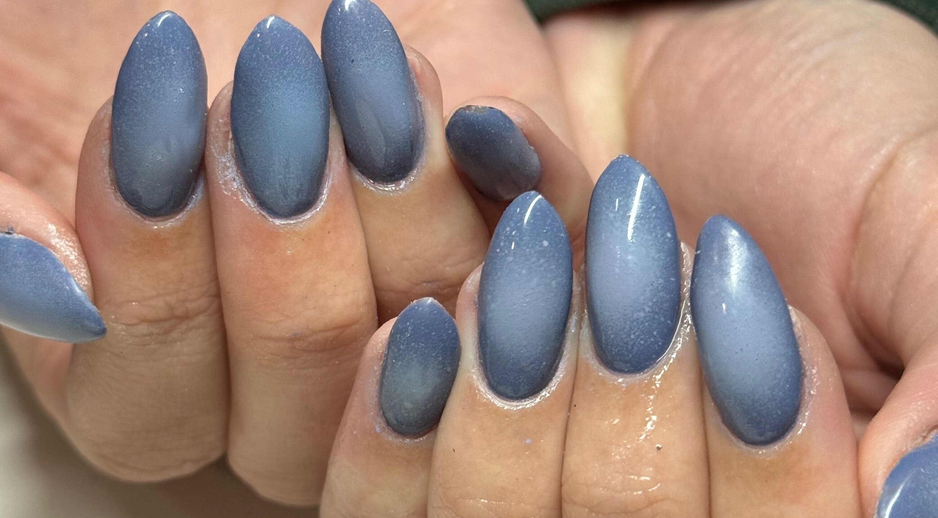 Close-up of elegant indigo nails at Curedbykais, Logan, Utah, US, showcasing expert manicure finishing.