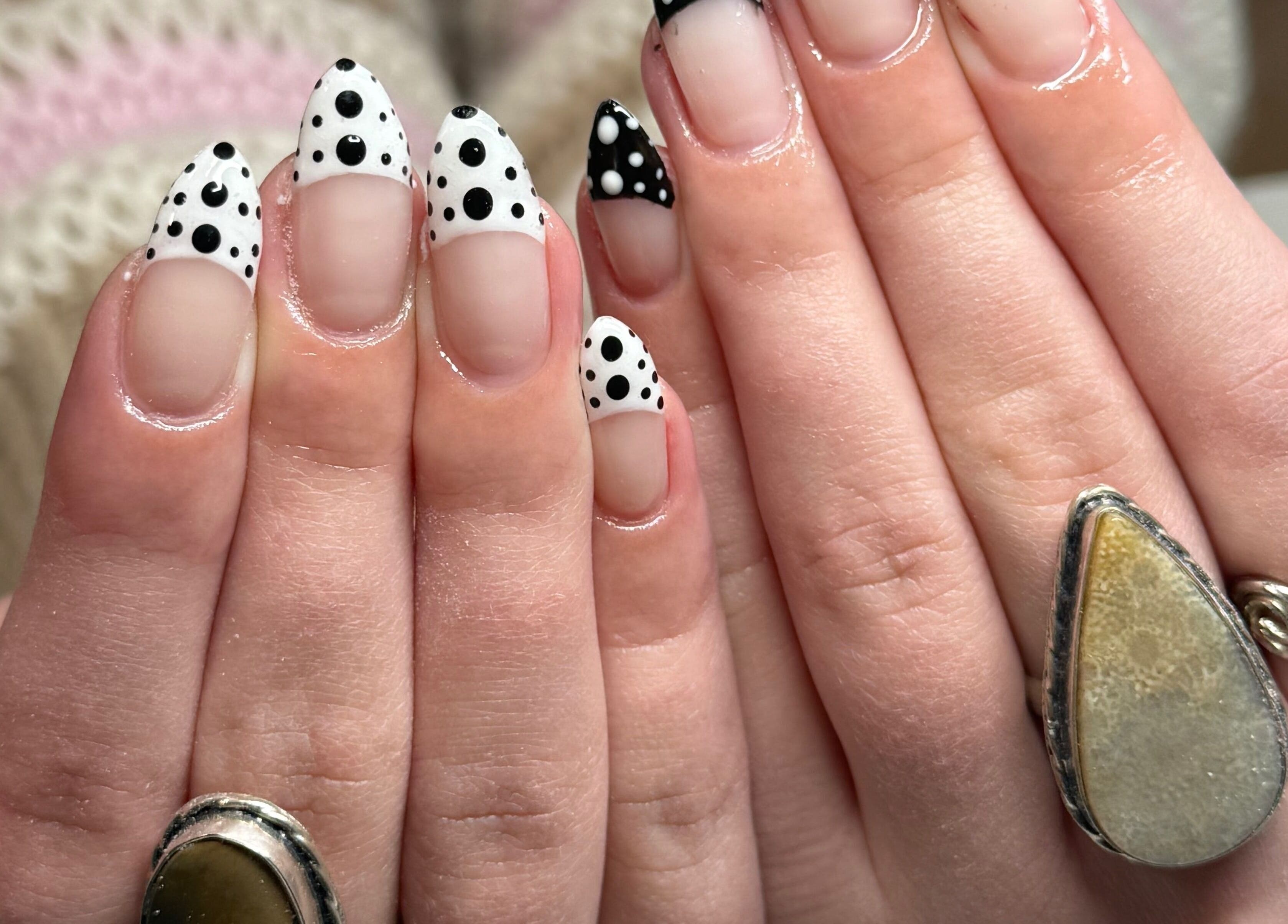 Detailed black and white polka dot nail art at Curedbykais, Logan, Utah, US.