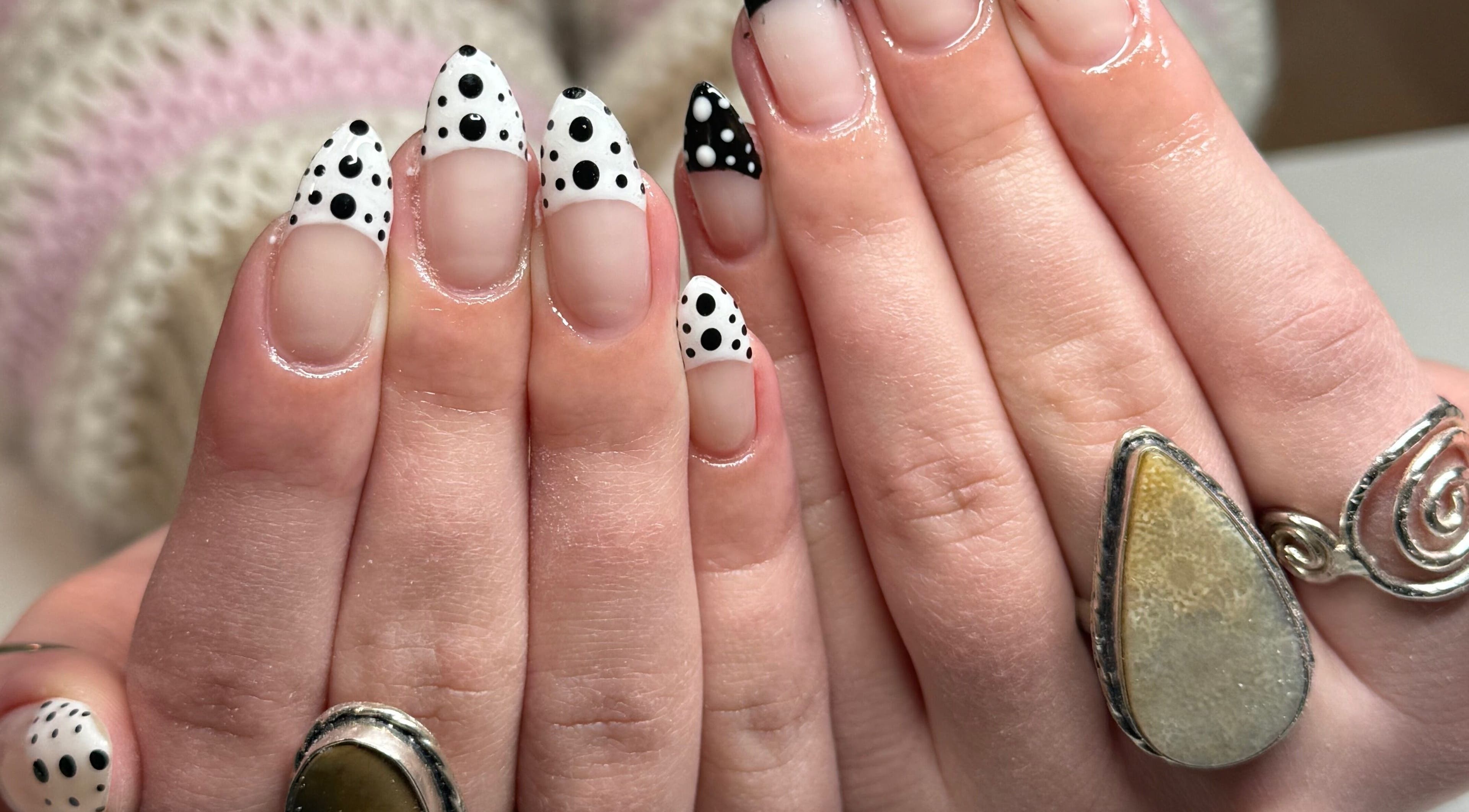 Detailed black and white polka dot nail art at Curedbykais, Logan, Utah, US.