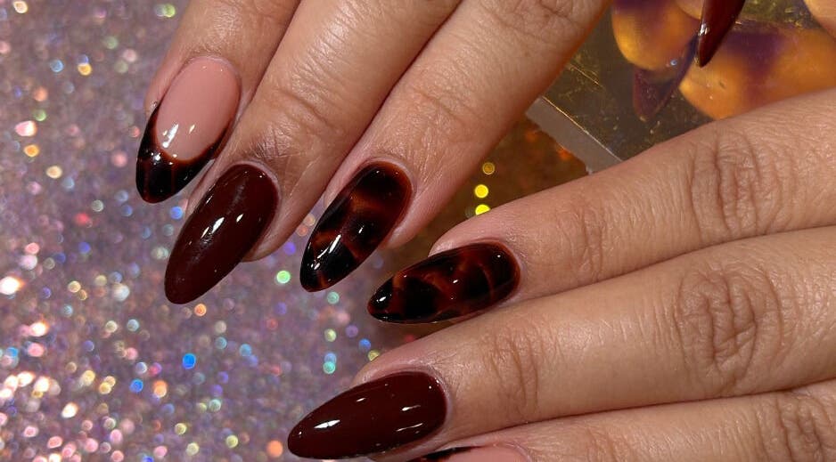 Stylish dark maroon nail design at NailsByLea in Bell Gardens, California, US.