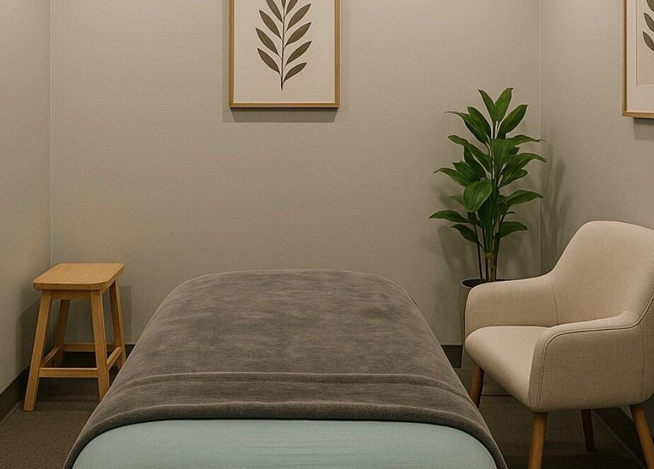 Serene massage room at Aura Eleven Massage, Stafford Township, New Jersey, US, featuring soothing decor.