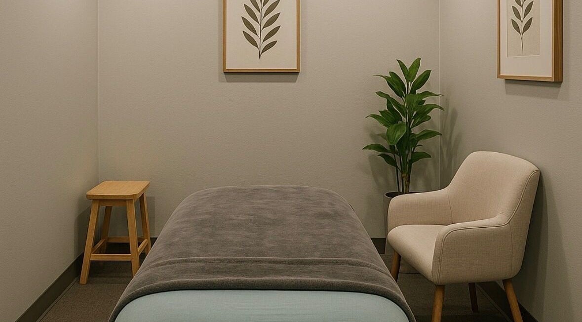 Serene massage room at Aura Eleven Massage, Stafford Township, New Jersey, US, featuring soothing decor.
