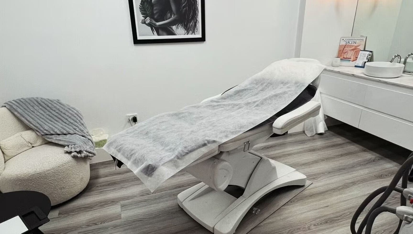 Sleek beauty treatment room at Lumi Whitening, Melbourne, Victoria, AU, with a modern facial bed and serene decor.