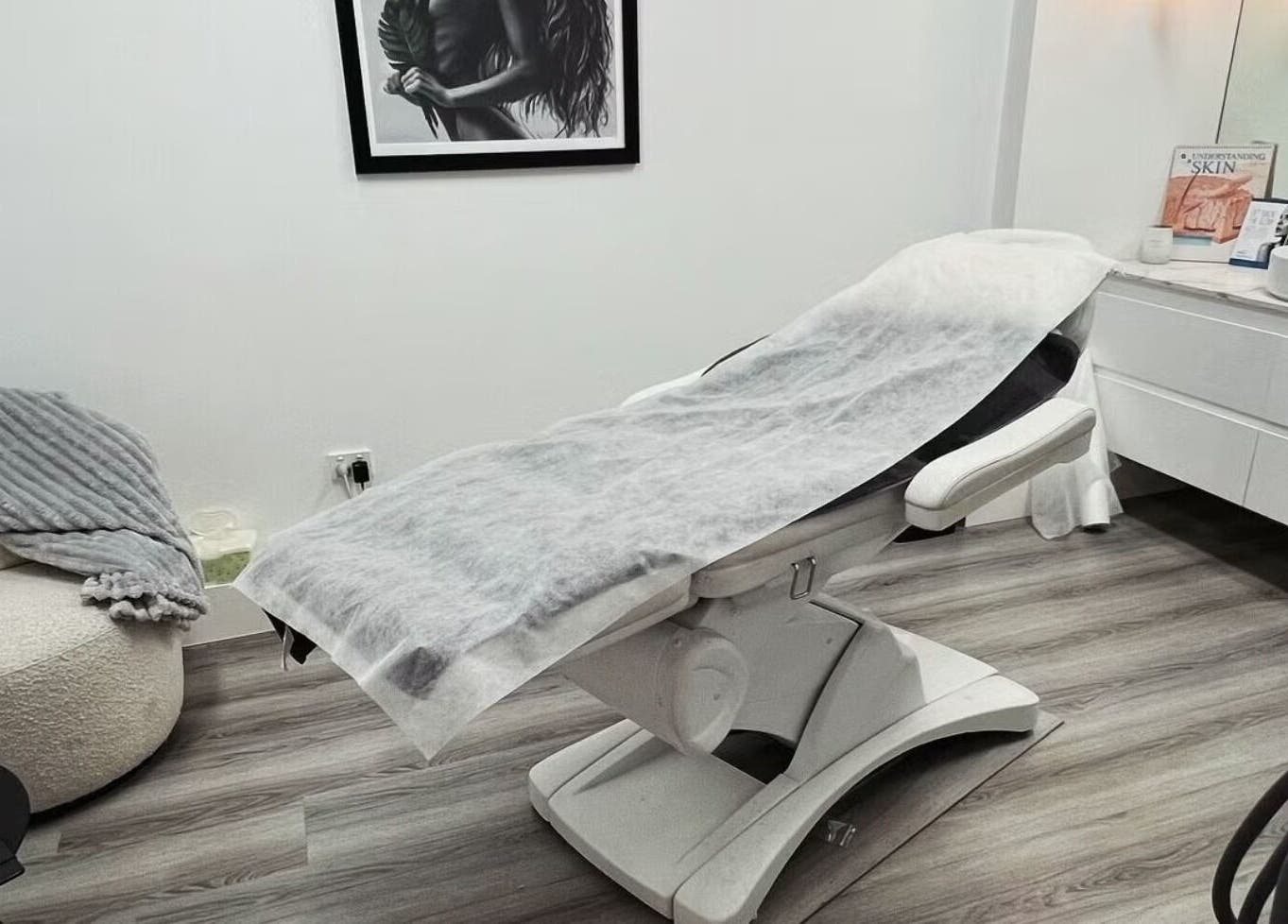 Sleek beauty treatment room at Lumi Whitening, Melbourne, Victoria, AU, with a modern facial bed and serene decor.