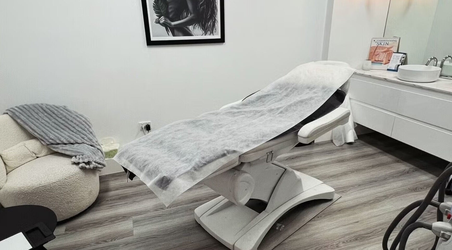 Sleek beauty treatment room at Lumi Whitening, Melbourne, Victoria, AU, with a modern facial bed and serene decor.