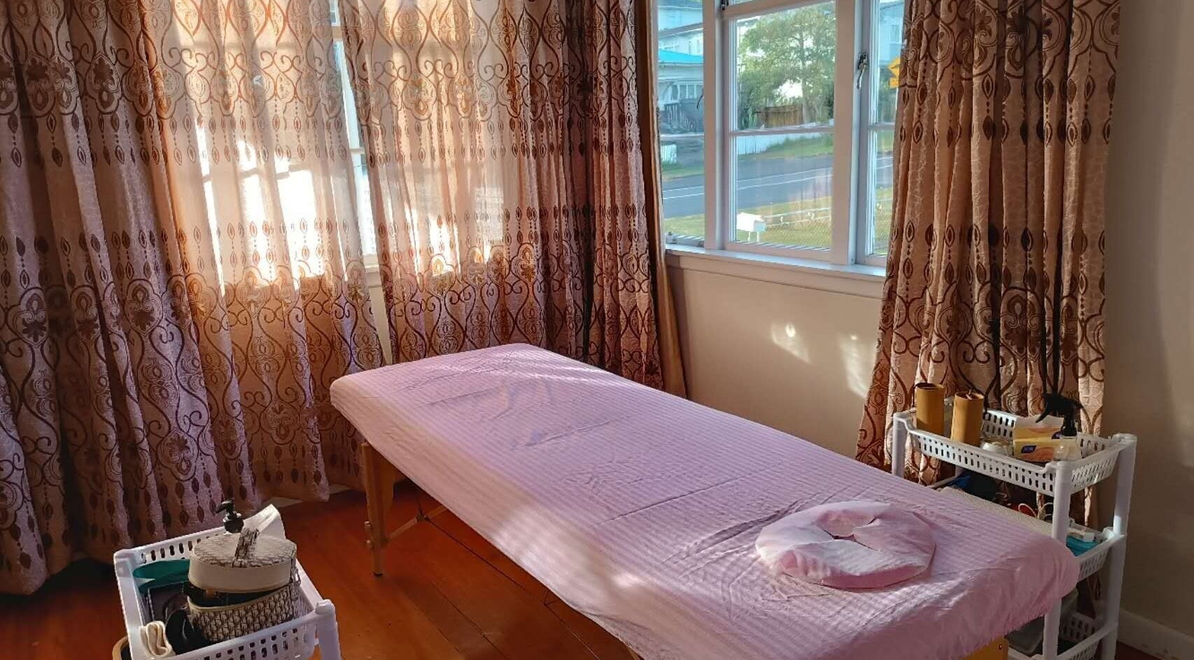 Cozy massage room at Harmony River - Home Studio (Sandringham), Auckland, NZ with soft pink decor.
