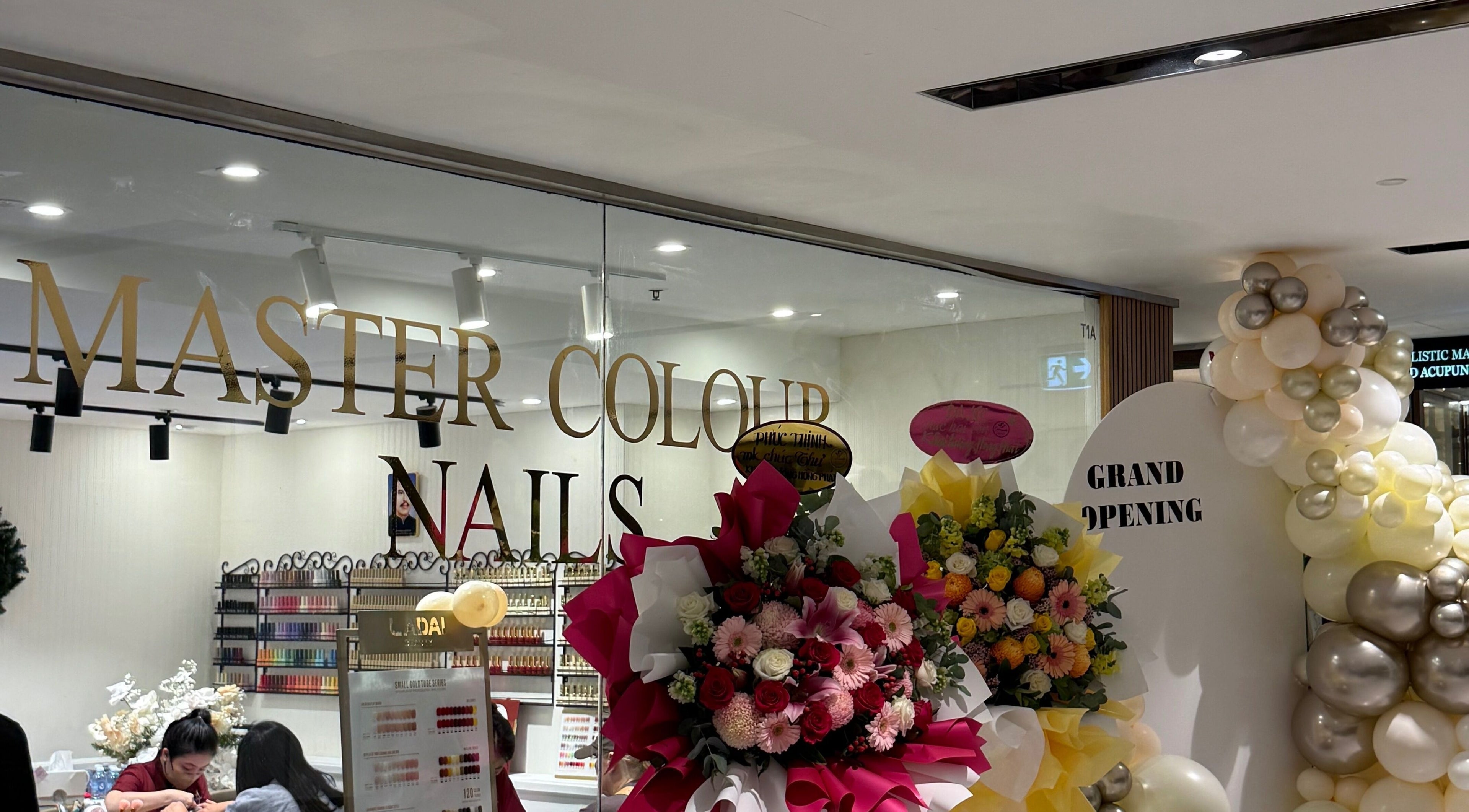 Grand opening of Master Colour Nails in Sydney, New South Wales, AU with floral decor and vibrant ambiance.