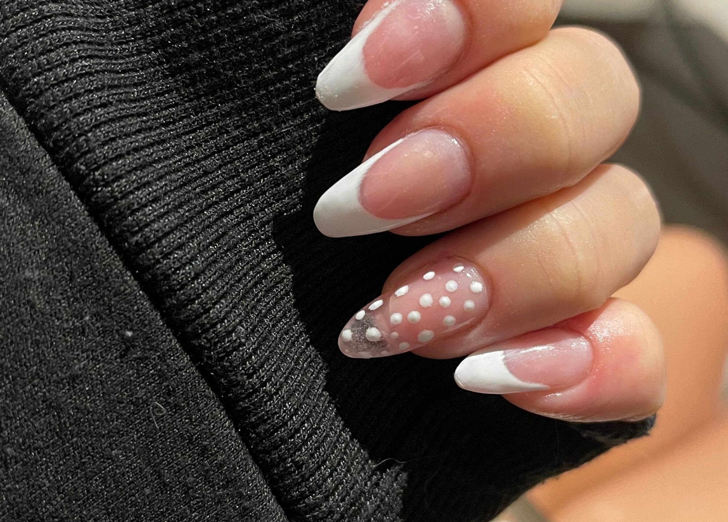 Elegant French manicure with polka dots at Polished Touch By Becca, Cape Town, Western Cape, ZA.