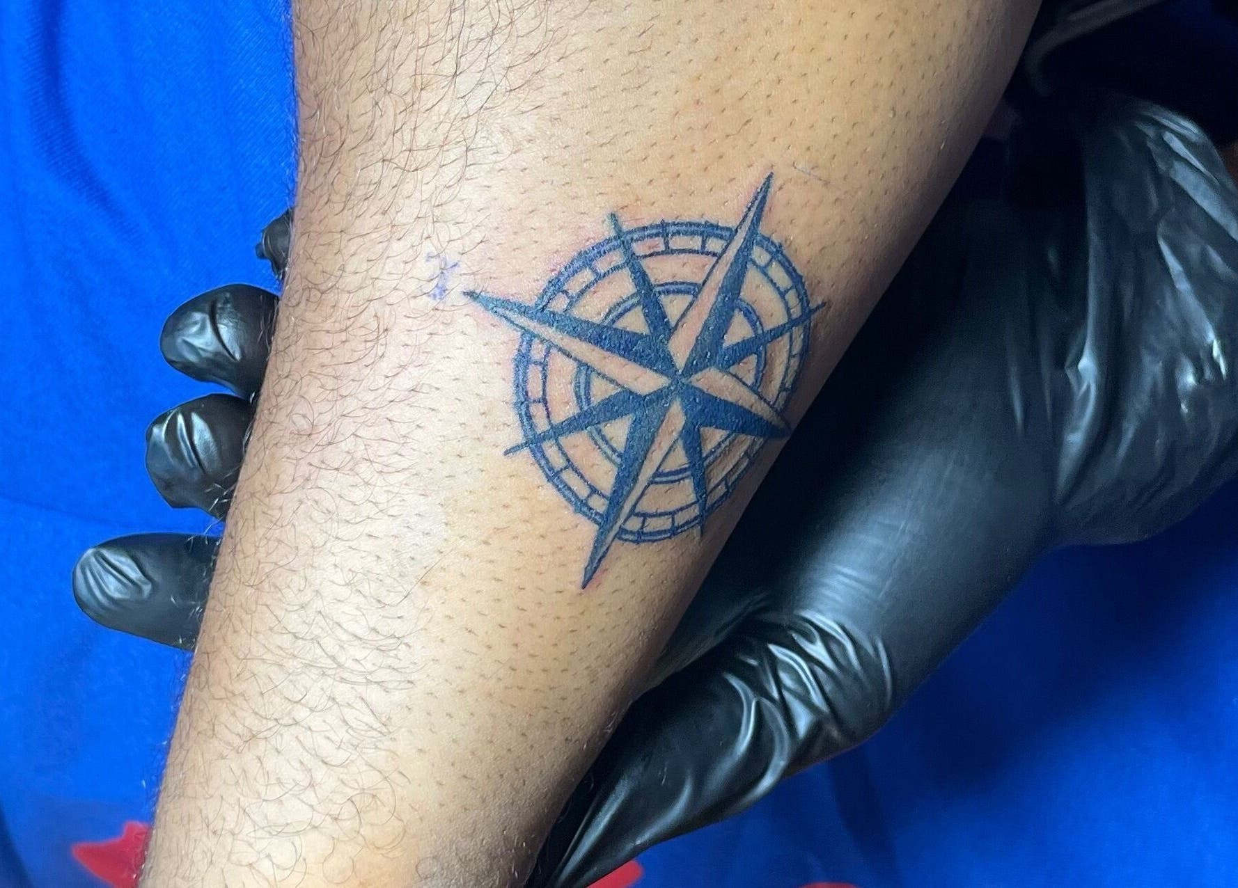 Compass tattoo design at THE URBAN ARTISAN, Lagos, Lagos, NG. Inked with precision for a bold look.