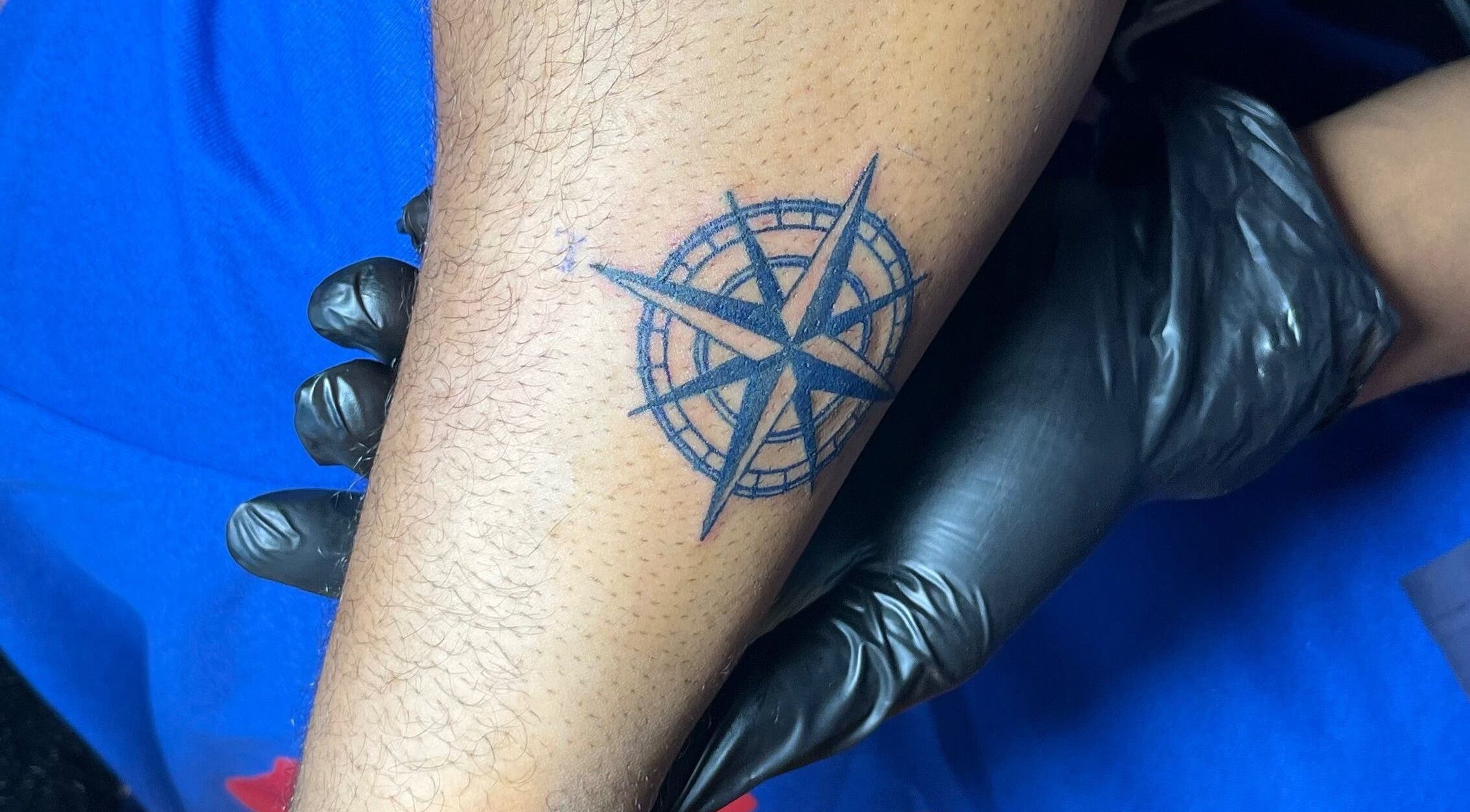 Compass tattoo design at THE URBAN ARTISAN, Lagos, Lagos, NG. Inked with precision for a bold look.