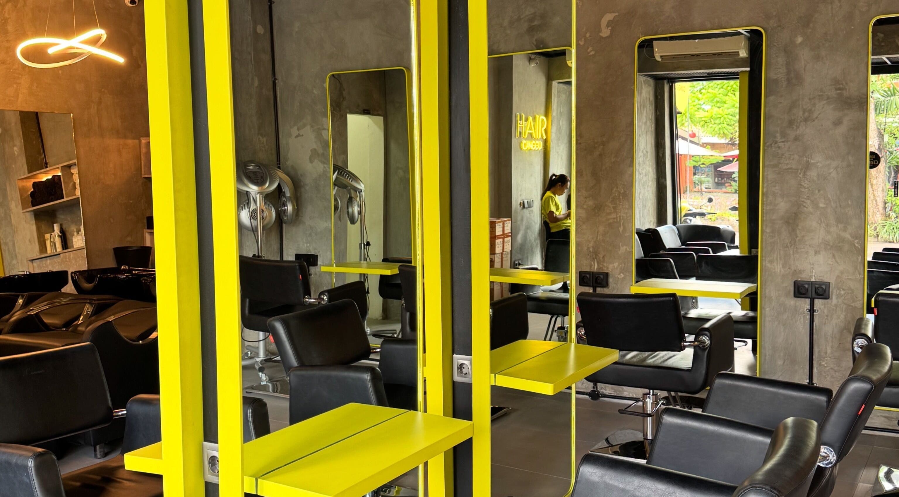Modern interior of HAIR Canggu in Bali, Bali, ID featuring stylish salon chairs and mirrors.