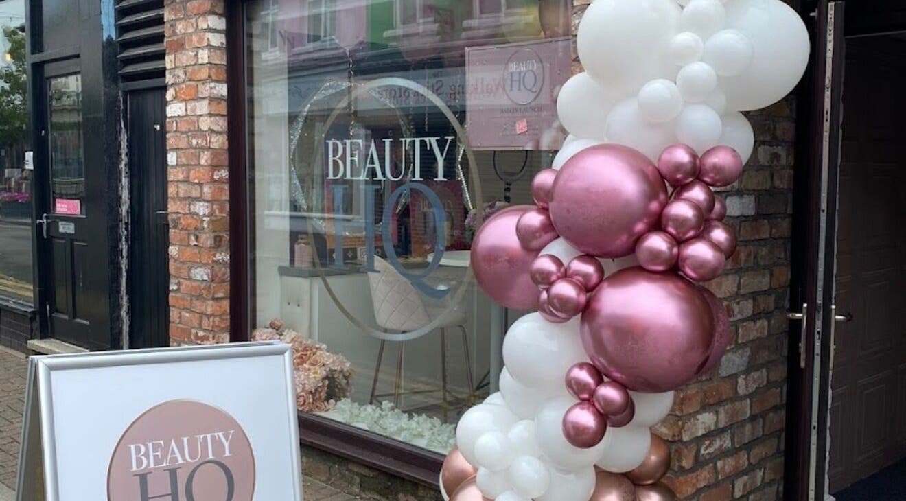 Elegant entrance of MPLashes in Southport, England, GB with pink and white balloon decor.