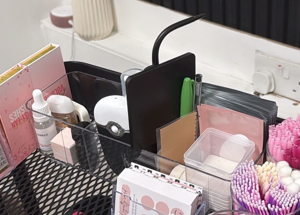 Beauty supplies organized at MPLashes, Southport, England, GB, showcasing pink brushes and skincare products.