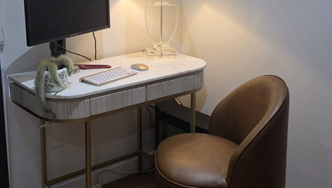 Modern desk setup with chair at Jocelyn Hair Xo, Melbourne, AU, offering a serene workspace.