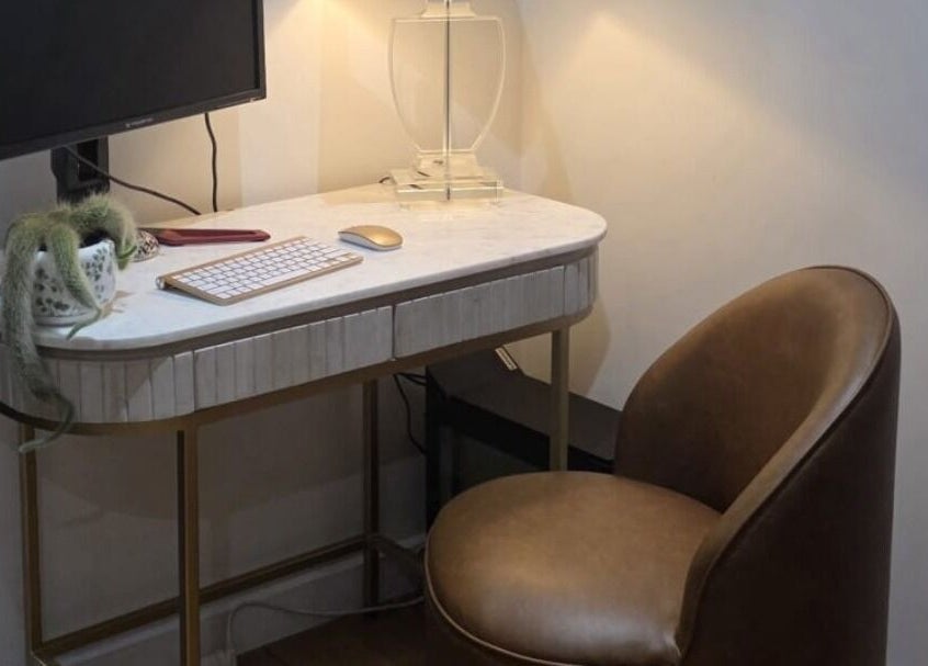 Modern desk setup with chair at Jocelyn Hair Xo, Melbourne, AU, offering a serene workspace.