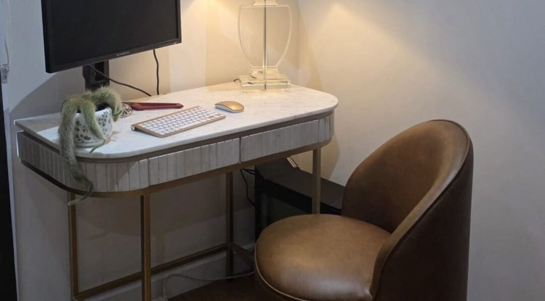 Modern desk setup with chair at Jocelyn Hair Xo, Melbourne, AU, offering a serene workspace.