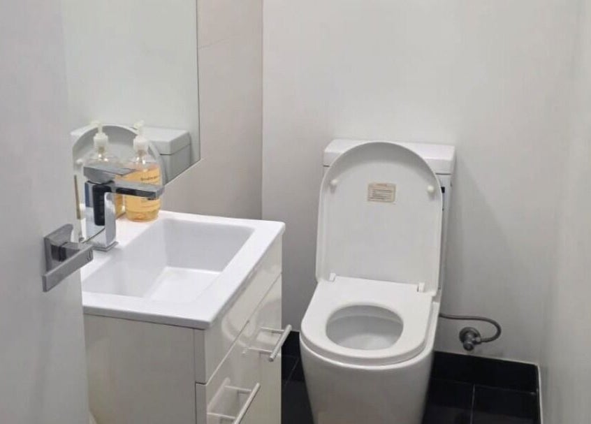 Clean restroom at Jocelyn Hair Xo in Melbourne, AU, featuring modern amenities for guest comfort.