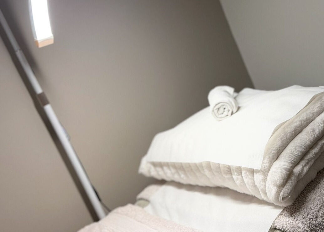 Relaxing treatment room with plush towels at Aesthetics by Carrieanne, Haxby, England, GB.