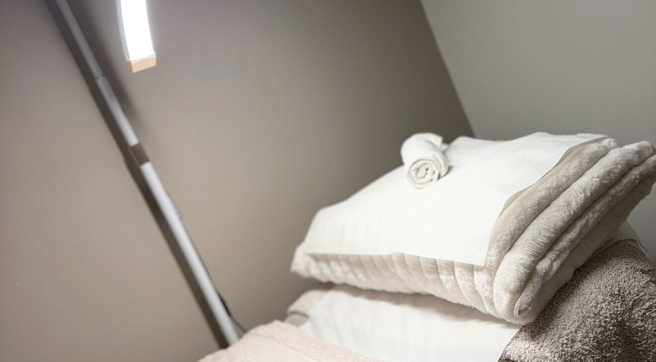 Relaxing treatment room with plush towels at Aesthetics by Carrieanne, Haxby, England, GB.