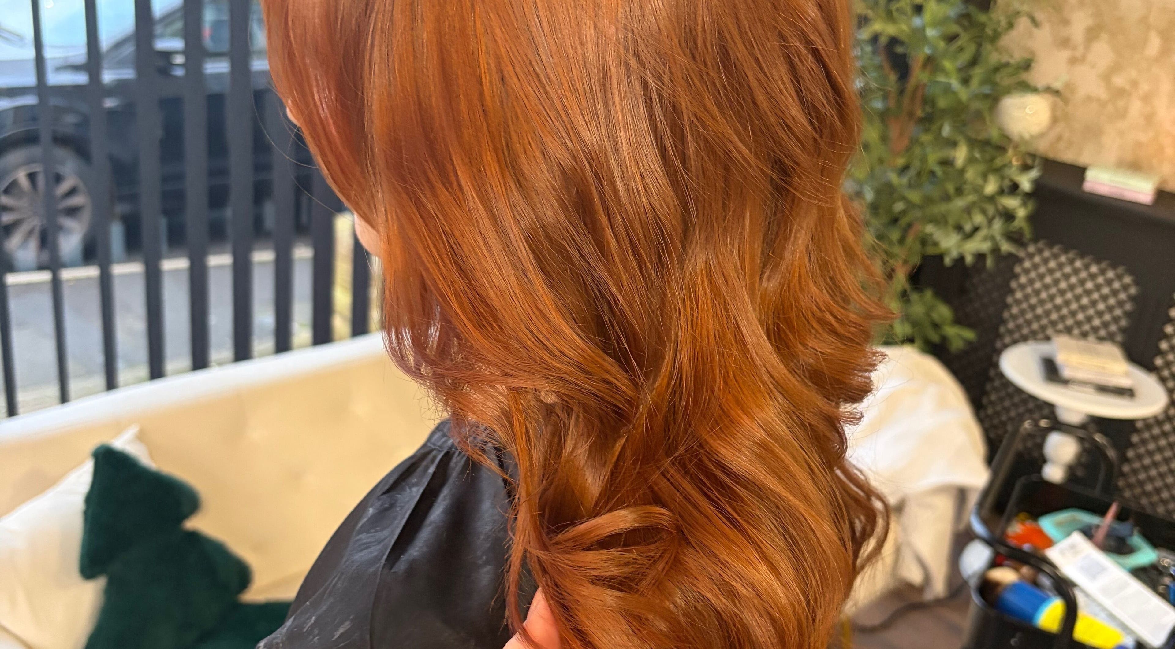 Stunning ginger curls styled at 133 by el ltd in Dewsbury, England, GB create a vibrant look.
