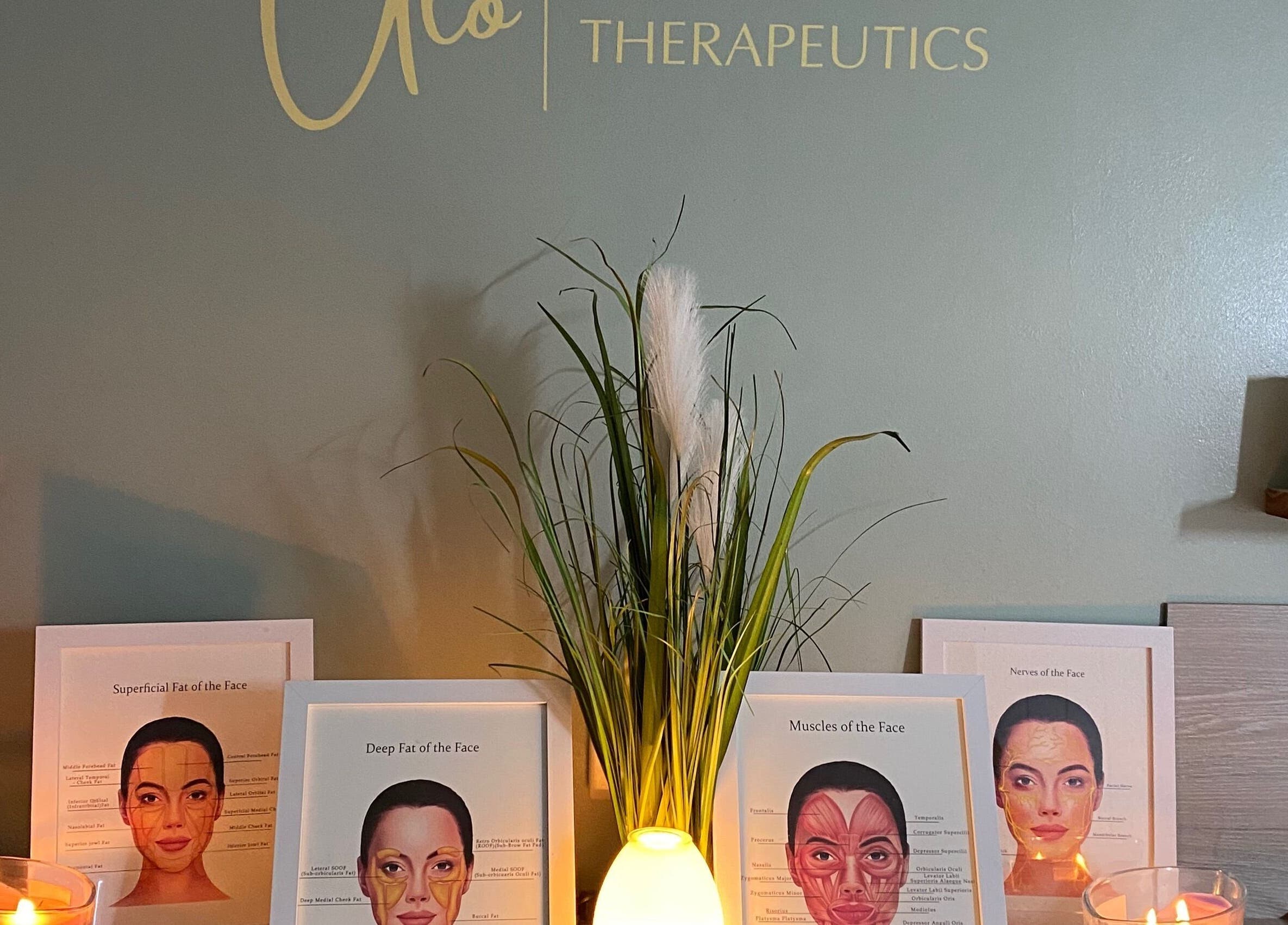 Aesthetic display with candles and facial anatomy charts at Neat Nurse, Talbot Green, Wales, GB.