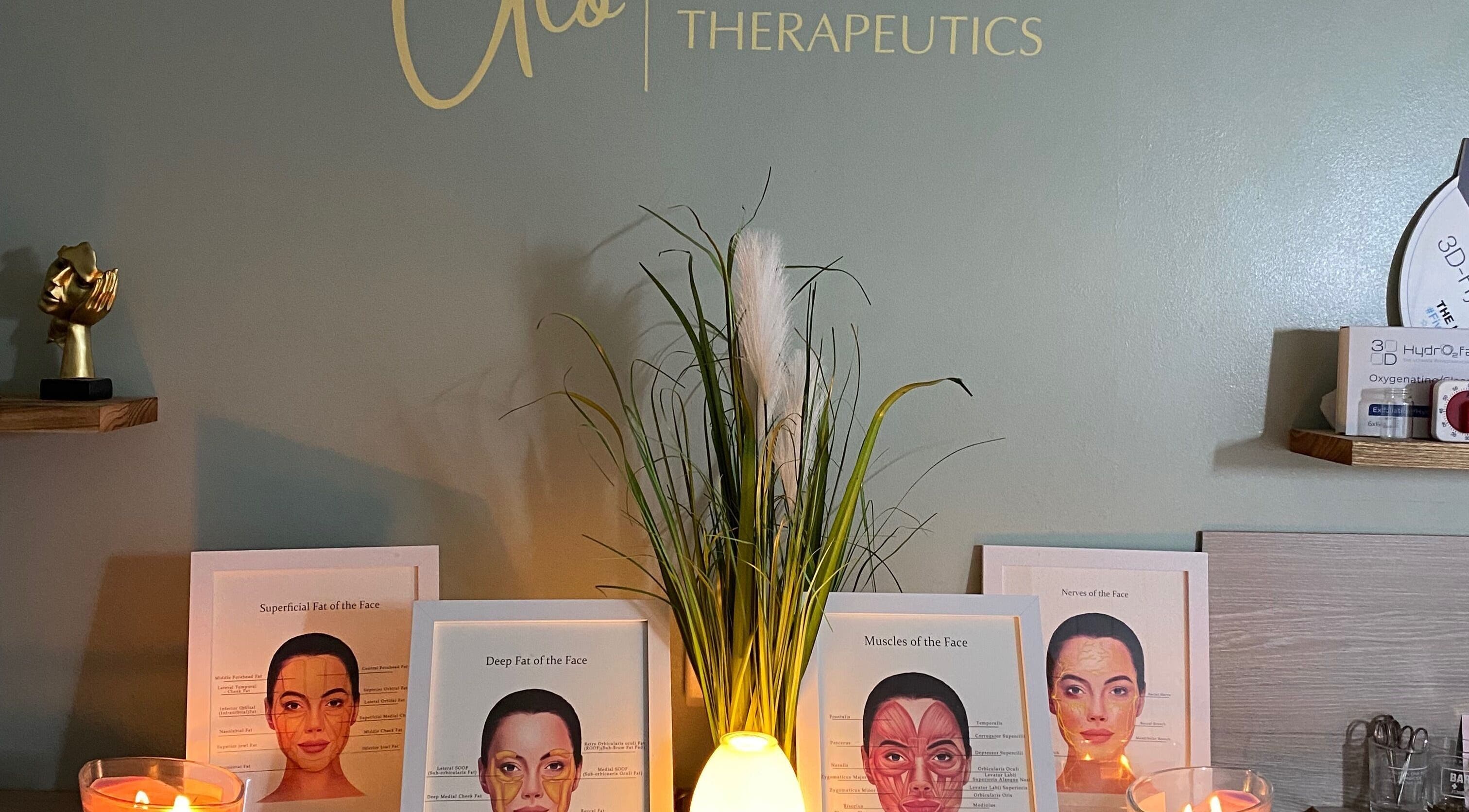 Aesthetic display with candles and facial anatomy charts at Neat Nurse, Talbot Green, Wales, GB.