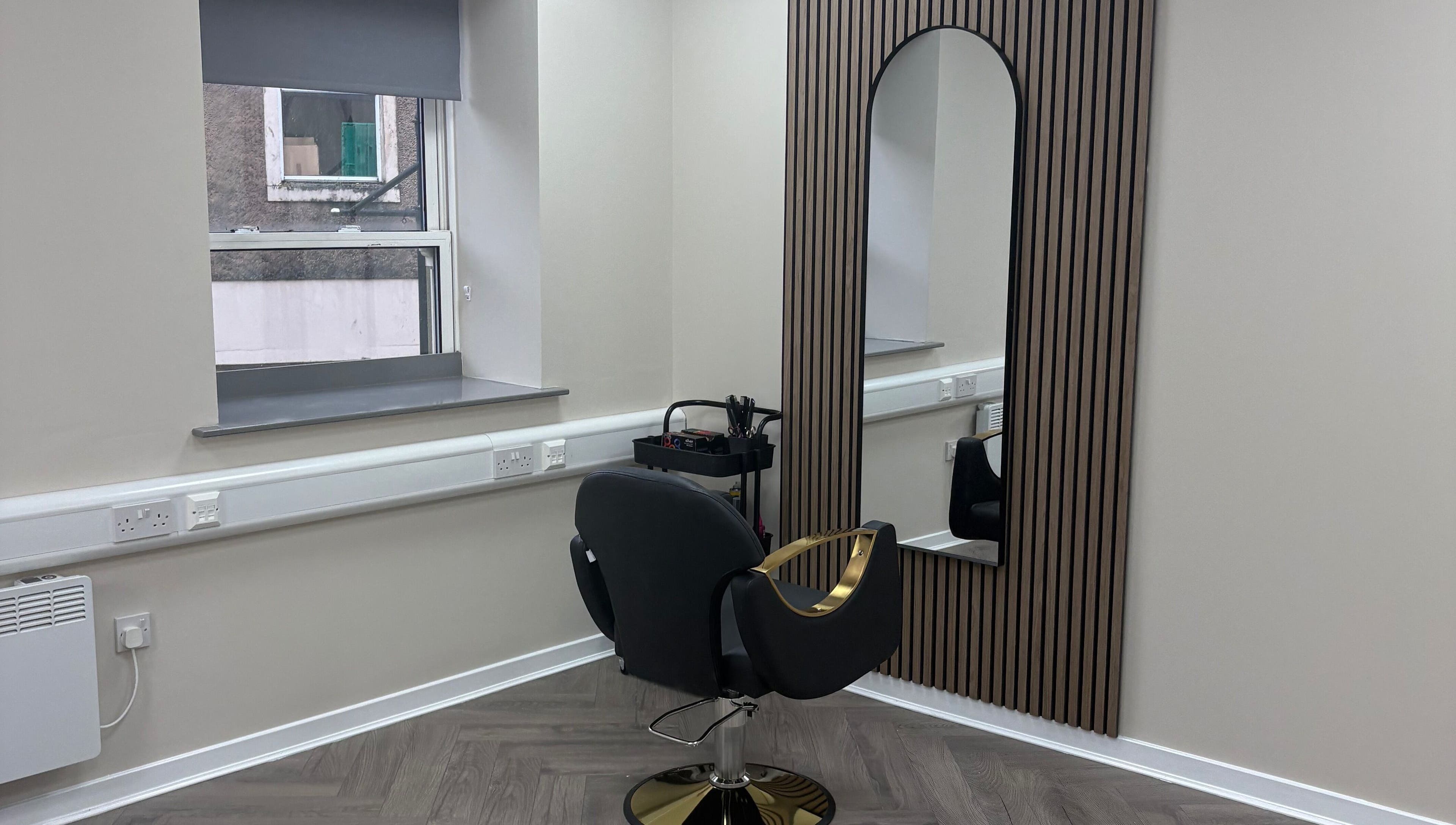 Modern beauty station at Abuela, Kilmarnock, Scotland, GB with stylish chair and large mirror.
