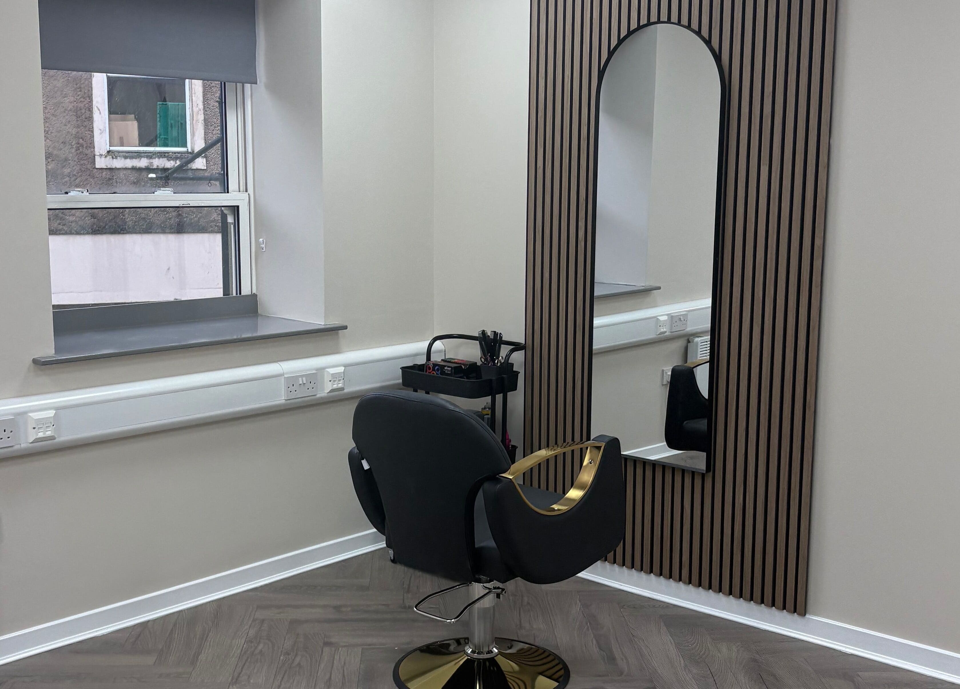 Modern beauty station at Abuela, Kilmarnock, Scotland, GB with stylish chair and large mirror.