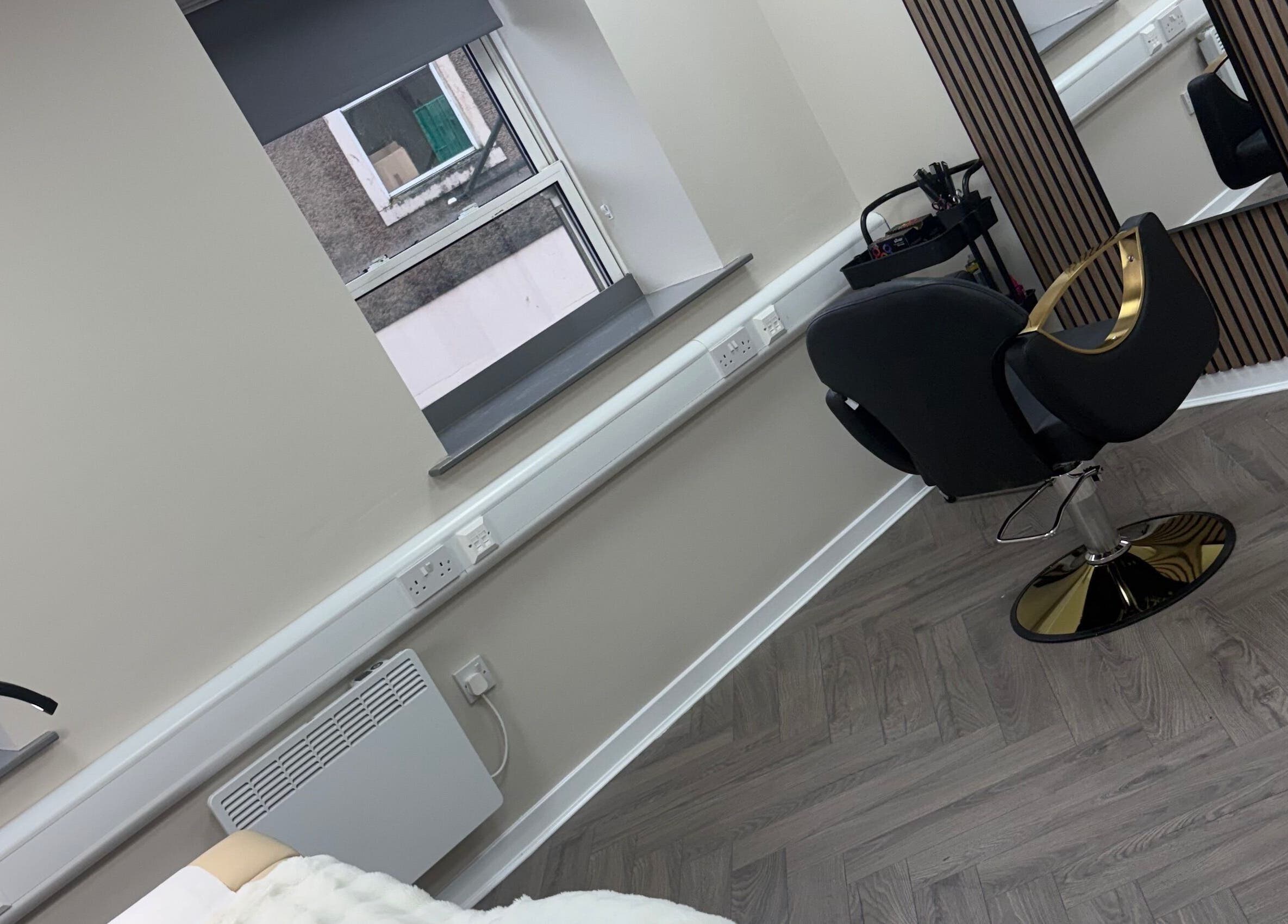 Modern salon chair and mirror at Abuela, Kilmarnock, Scotland, GB with elegant decor.