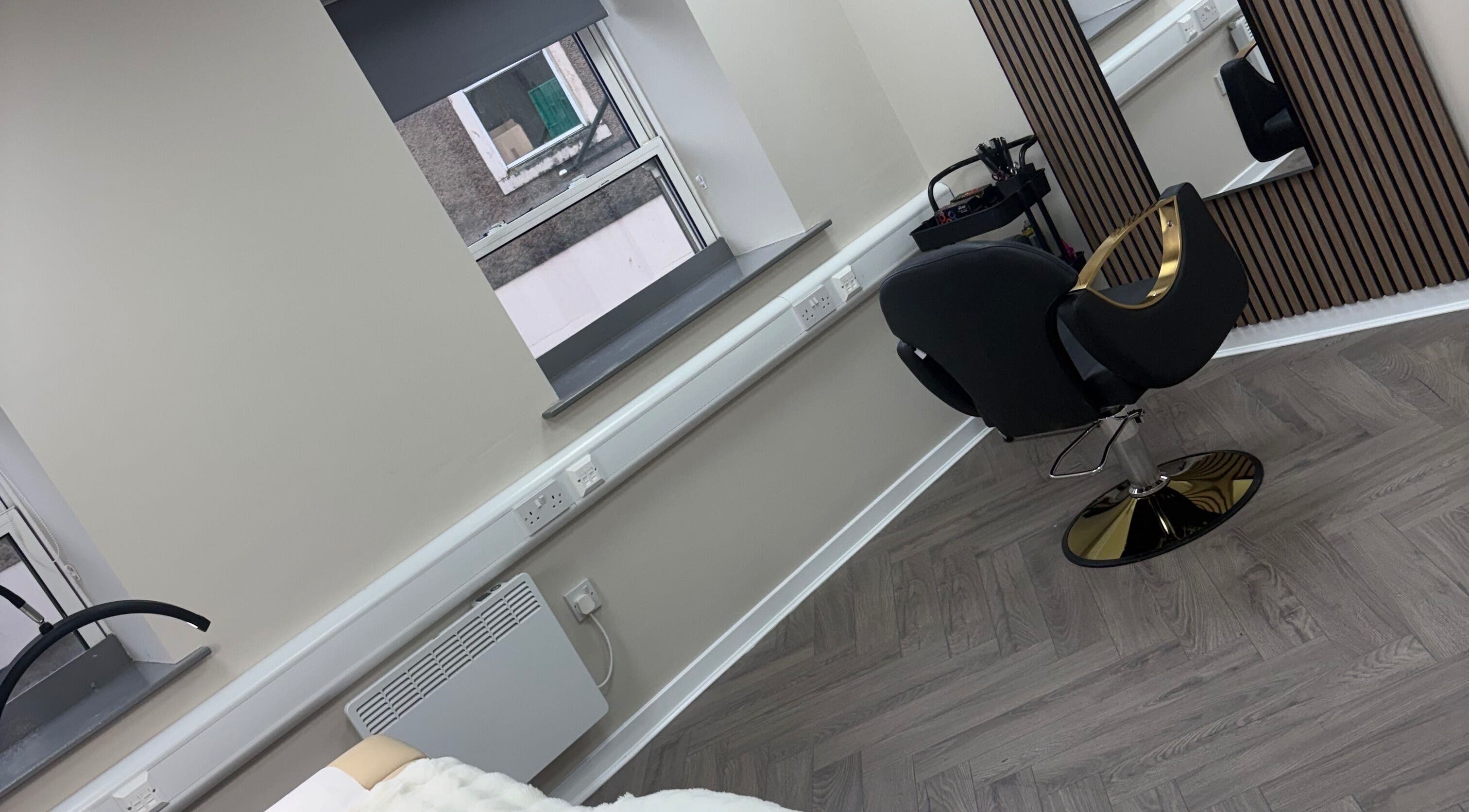 Modern salon chair and mirror at Abuela, Kilmarnock, Scotland, GB with elegant decor.