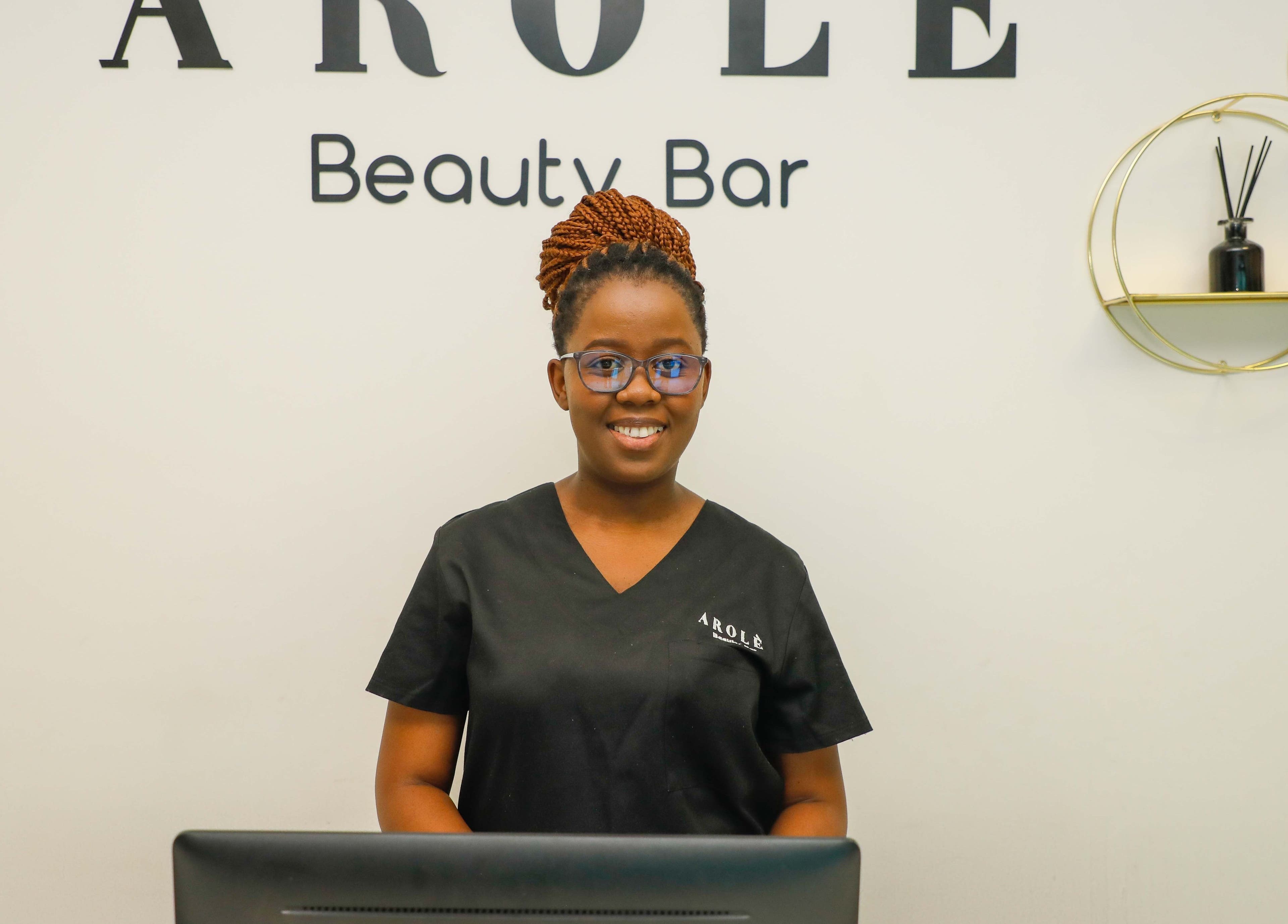 Friendly staff member at Arolè Beauty reception in Gaborone, Gaborone, BW.