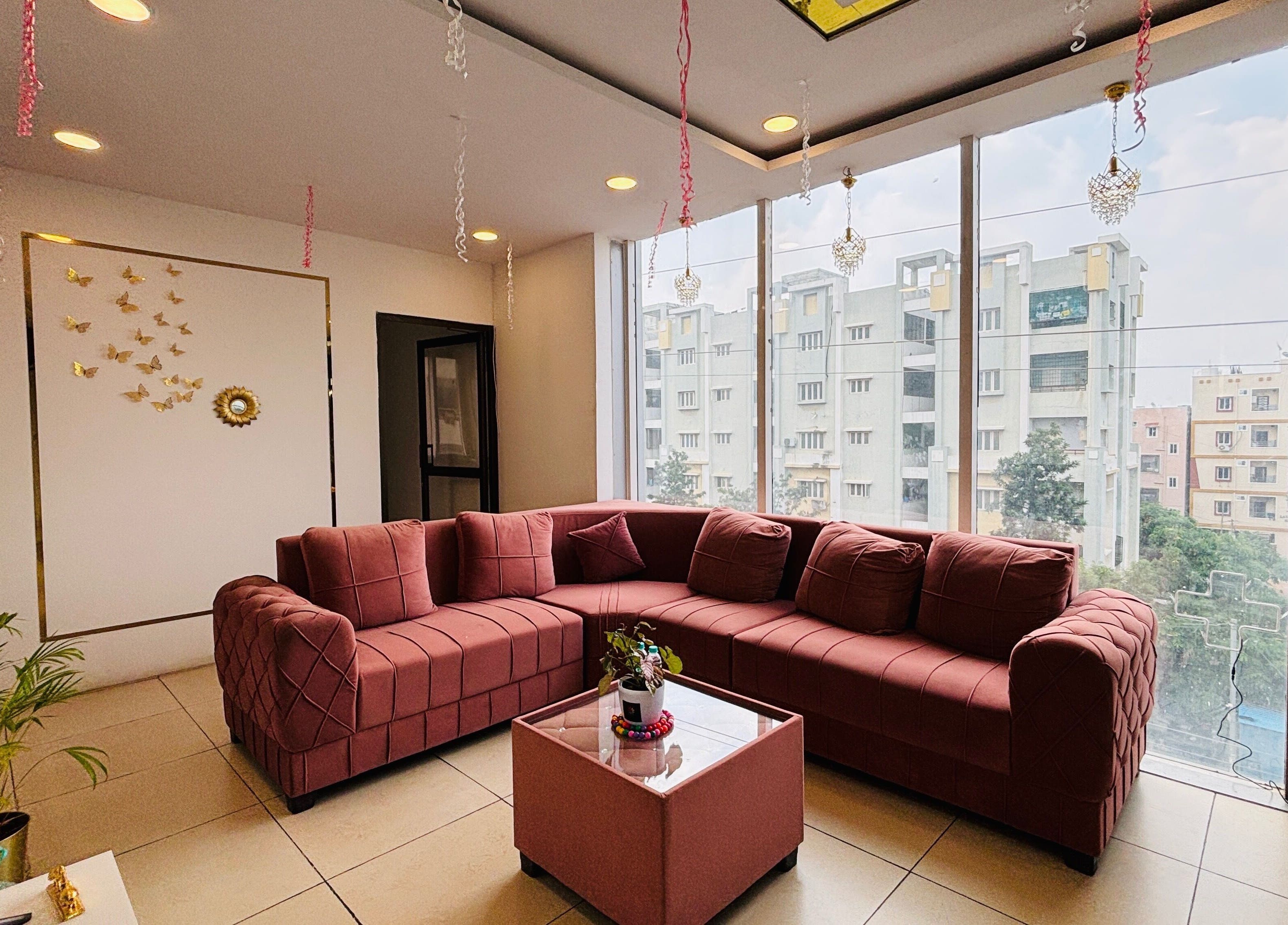Spacious lounge area at Dr.Akhilas Aesthetics, Hyderabad, Telangana, IN, featuring modern decor and natural light.