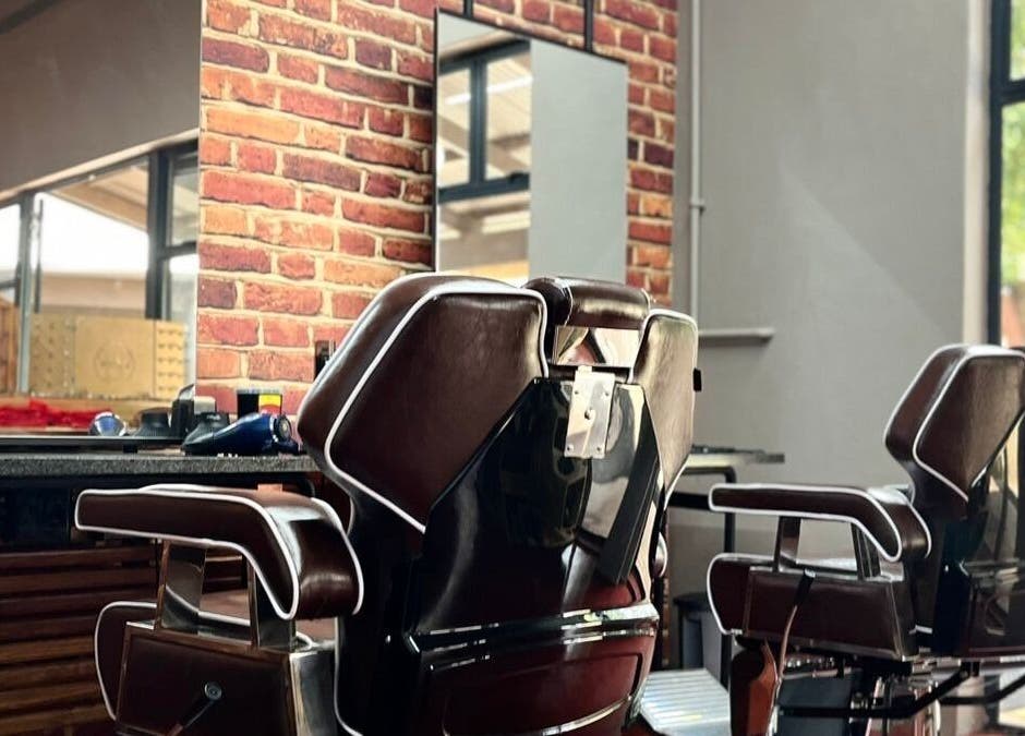 Classic barber chairs at Buffelsfontein Barbier Menlo Park in Pretoria, Gauteng, ZA for a stylish grooming experience.