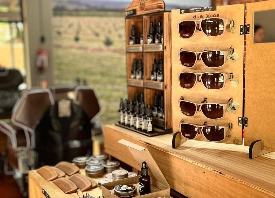 Rustic sunglass and grooming product display at Buffelsfontein Barbier Menlo Park, Pretoria, Gauteng, ZA.