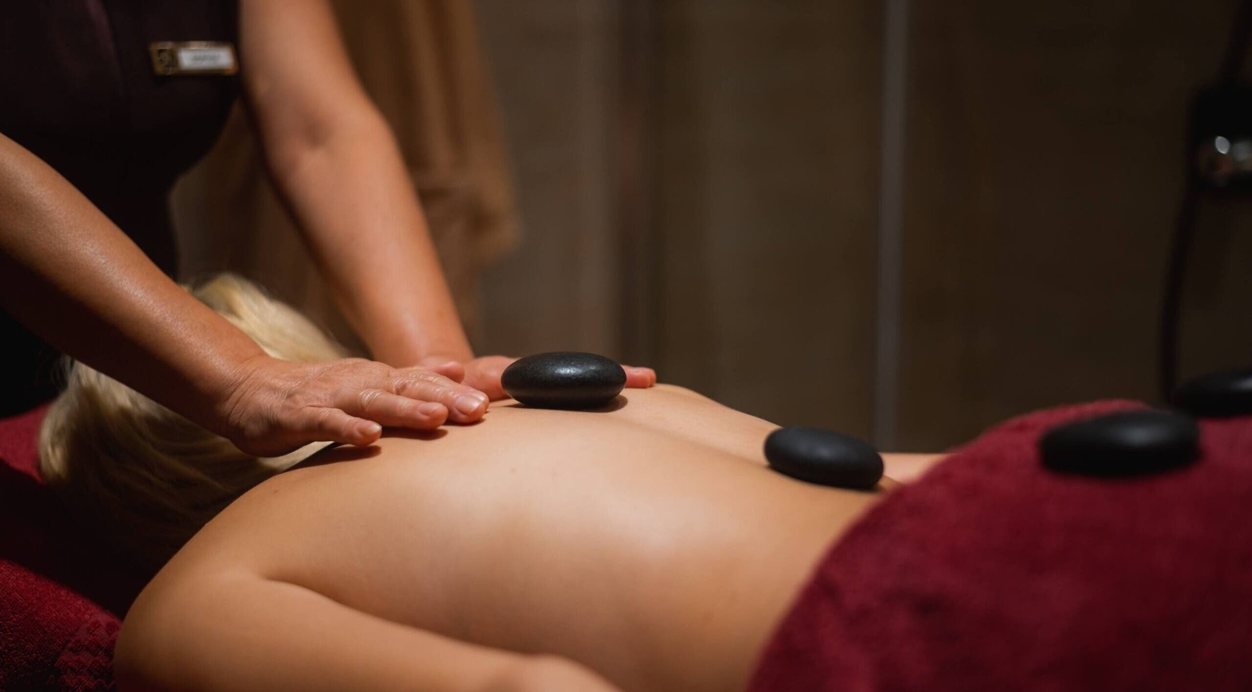 Luxurious hot stone massage at The Beauty Coven, Edinburgh, Scotland, GB. Relax in soothing ambiance.