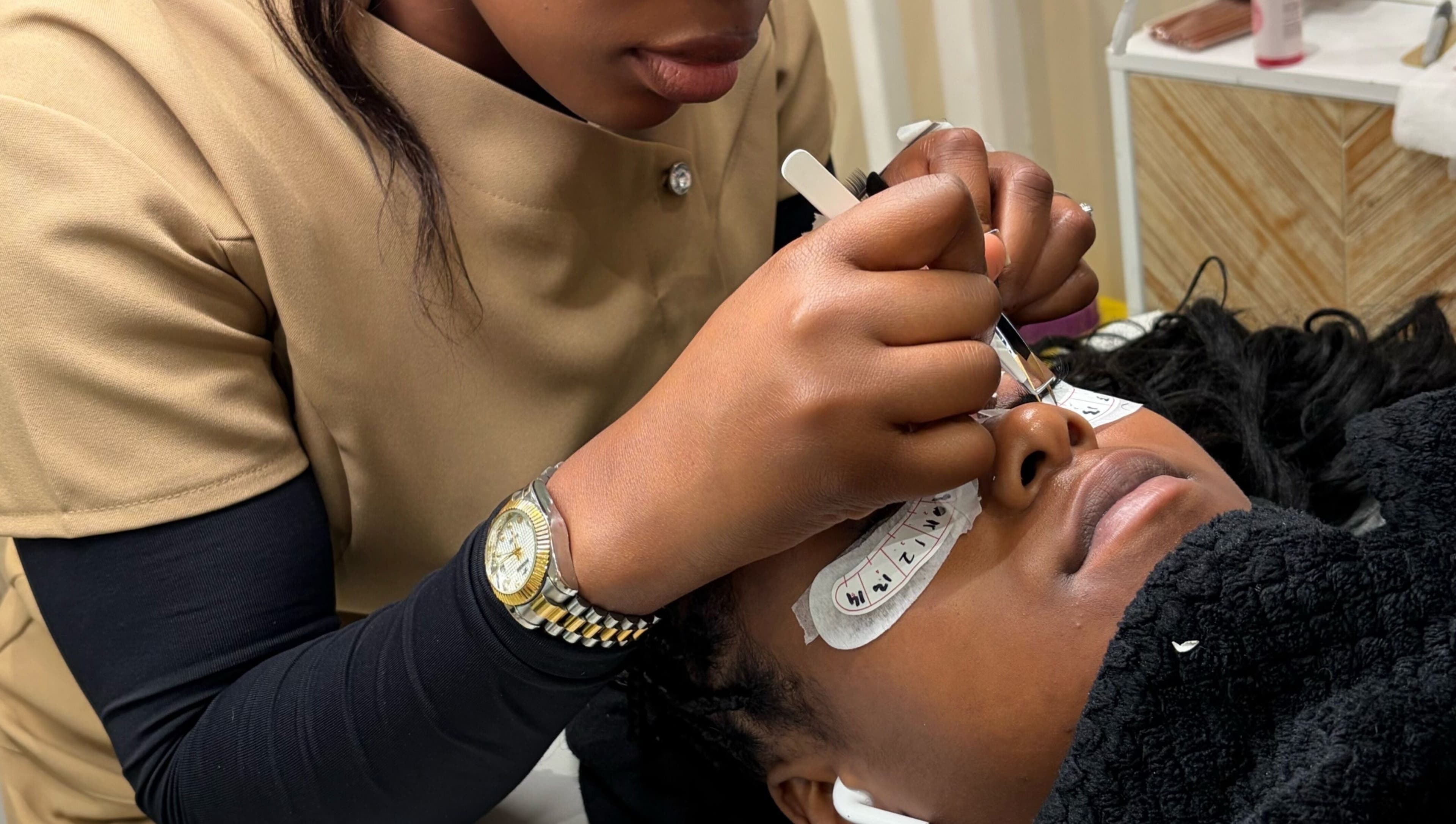 Lash artist at Miabeauty And Aesthetics in London, England, GB performing precision lash extension.