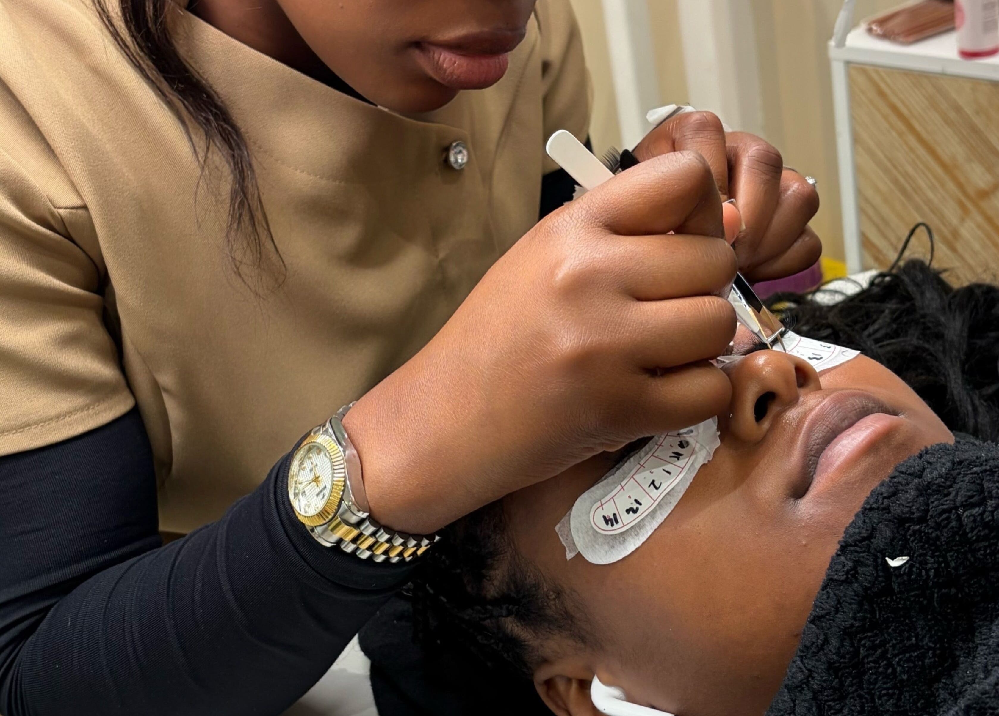 Lash artist at Miabeauty And Aesthetics in London, England, GB performing precision lash extension.