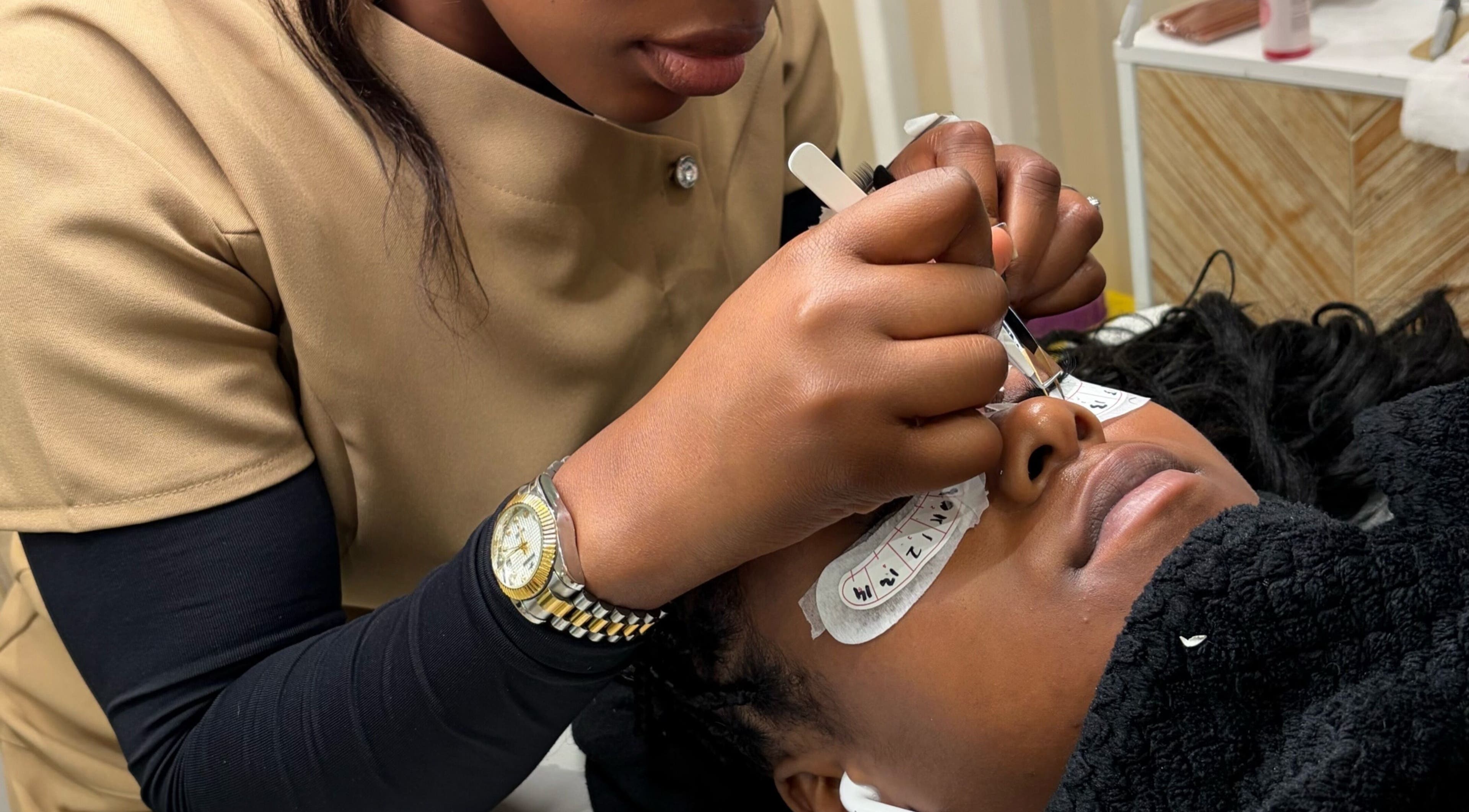Lash artist at Miabeauty And Aesthetics in London, England, GB performing precision lash extension.
