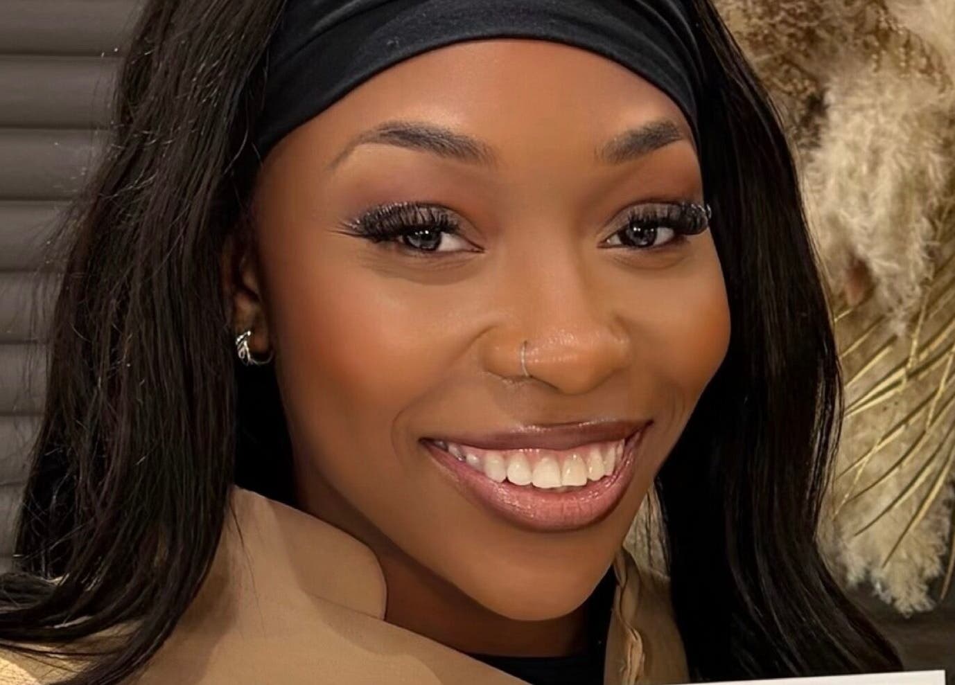 Client shows radiant smile after treatment at Miabeauty And Aesthetics, London, England, GB.