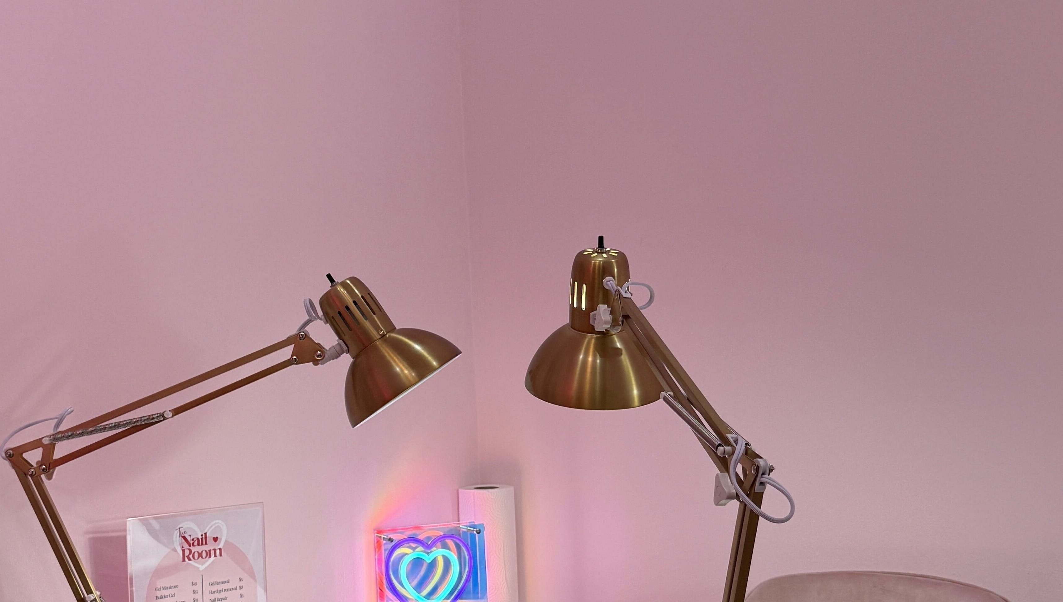 Elegant gold lamps in The Nail Room, Hialeah, Florida, US, creating a refined spa ambience.