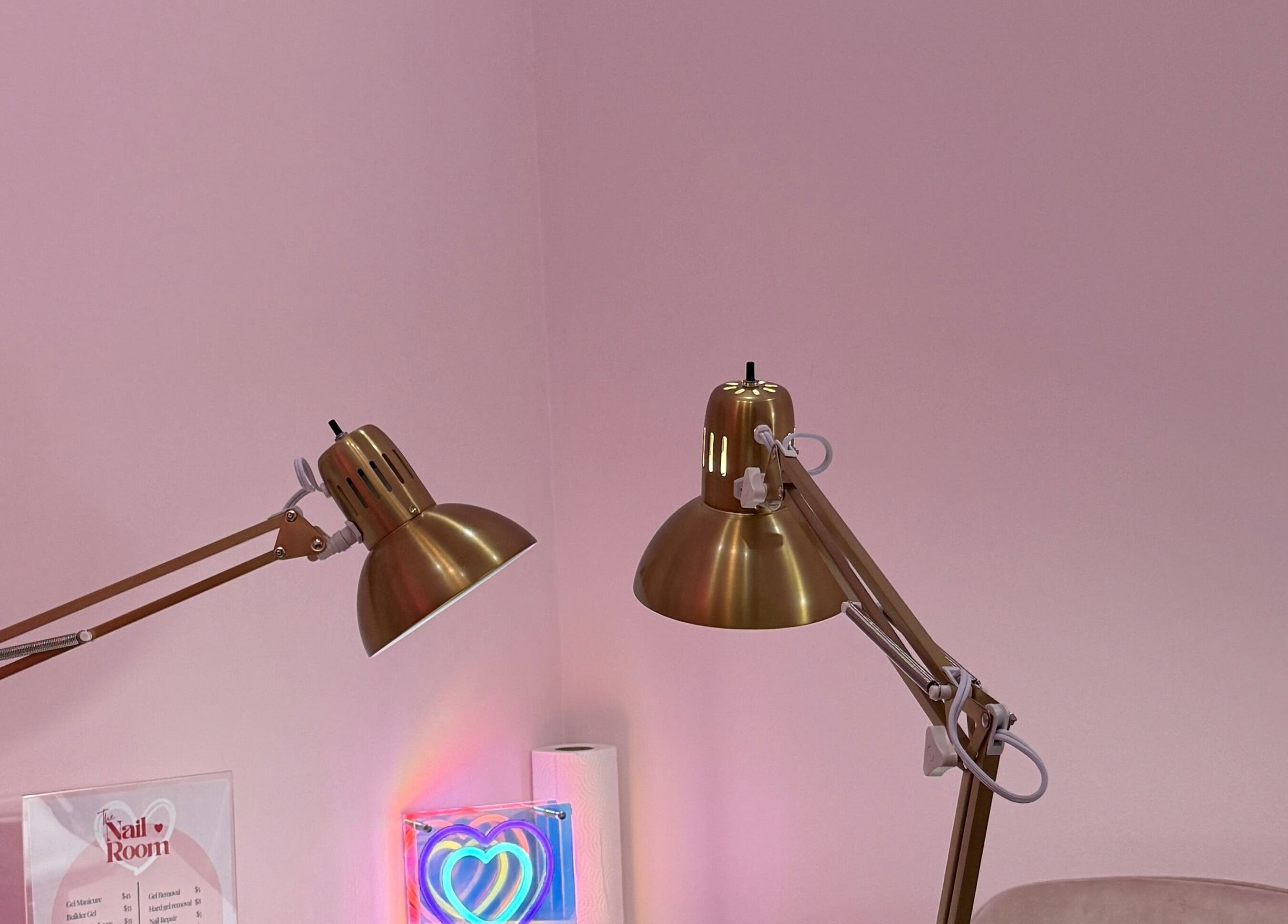 Elegant gold lamps in The Nail Room, Hialeah, Florida, US, creating a refined spa ambience.