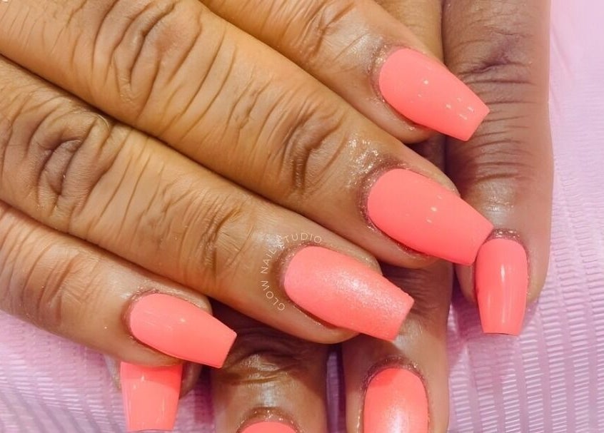 Bright coral nails from Glow Nail Studio in Cape Town, Western Cape, ZA, showcasing expert manicure.