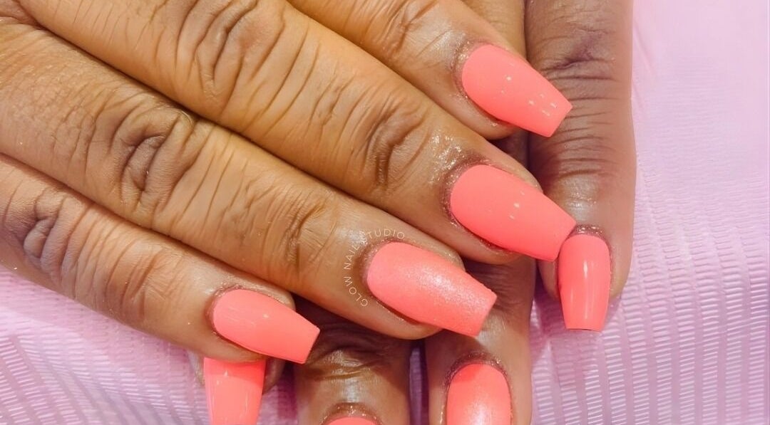 Bright coral nails from Glow Nail Studio in Cape Town, Western Cape, ZA, showcasing expert manicure.