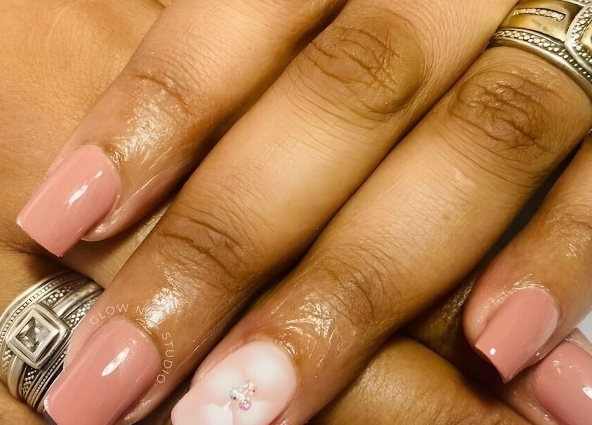 Stylish pink manicure at Glow Nail Studio, Cape Town, Western Cape, ZA, featuring elegant nail art.