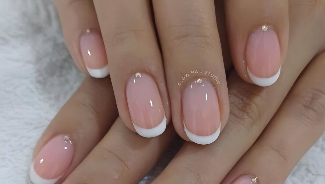 Close-up of elegant French manicure at Glow Nail Studio, Cape Town, Western Cape, ZA.